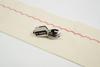 Brother dynamic walking foot creating decorative red stitch on cream fabric