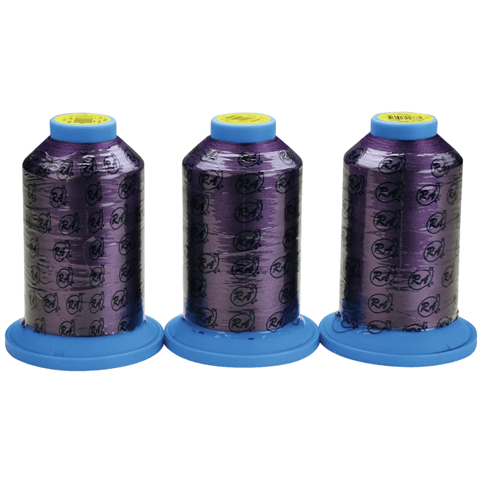 Three purple embroidery thread spools with blue caps displaying Brother logo