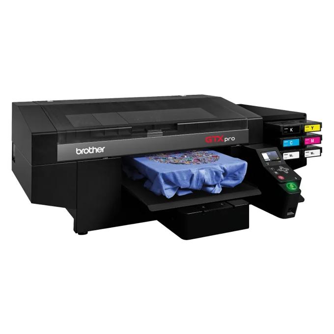 Brother GTX PRO direct-to-garment printer with bulk ink system printing on blue fabric