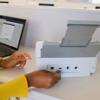 Brother ADS4300N desktop document scanner with automatic document feeder on office desk