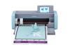Brother ScanNCut DX cutting machine with touchscreen and mat loaded with paper cutouts