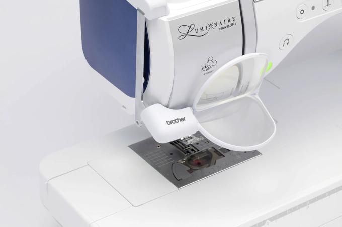 Brother Luminaire Innov-is XP1 embroidery machine with open magnetic hoop and Disney design