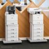 Brother laser printers with multi-drawer paper trays in modern office workspace