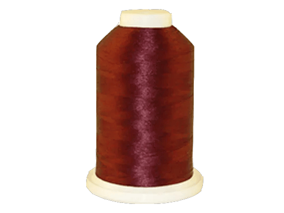 Brother embroidery thread spool in burgundy with cream cap on white background