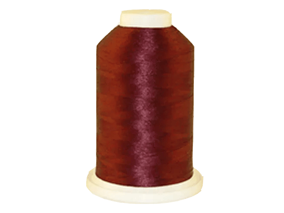 Brother embroidery thread spool in burgundy with cream cap on white background