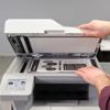 Brother MFC-L5715DW all-in-one laser printer with open scanner lid and document on glass