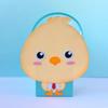 Cartoon chick character on turquoise gift bag with handle
