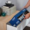 Person placing Brother TN890 toner cartridge into office drawer
