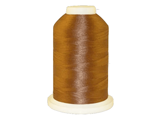 Brother embroidery thread spool in golden brown on white background