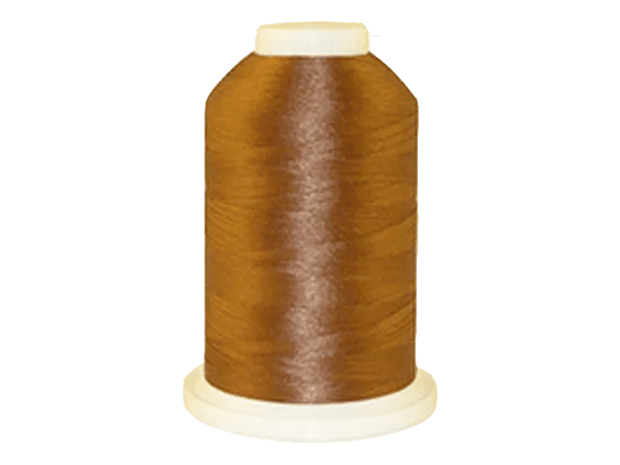 Brother embroidery thread spool in golden brown on white background