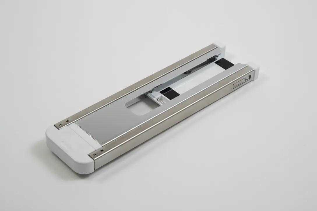 Brother printer tubular frame component with metal rails and white base