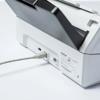 Brother printer rear panel with USB cable connected to port