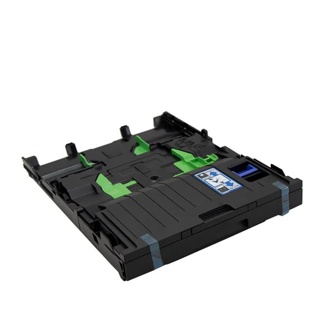 Brother printer paper tray with green guides and blue label on white background