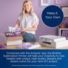 Woman holding custom sublimation-printed shirt next to Brother all-in-one wireless printer