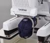 Brother PR1060W embroidery machine stitching monogram on navy blue cap