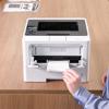 Brother HL-L5210DN monochrome laser printer with hand loading envelope into manual feed slot