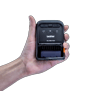 Hand holding Brother RJ-2035 portable mobile printer with thermal printing