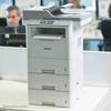 Brother monochrome laser all-in-one printer with dual paper trays in office setting