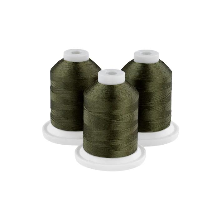 Three army green embroidery thread spools on white bases
