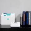 Brother P-touch label maker with labeled file organizer and binders on office desk