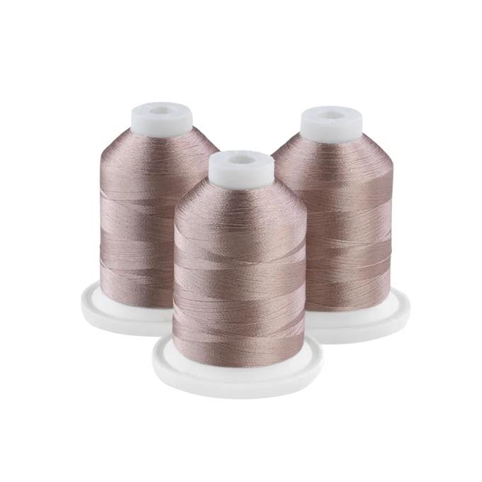 Three taupe embroidery thread spools on white bases for sewing and crafting