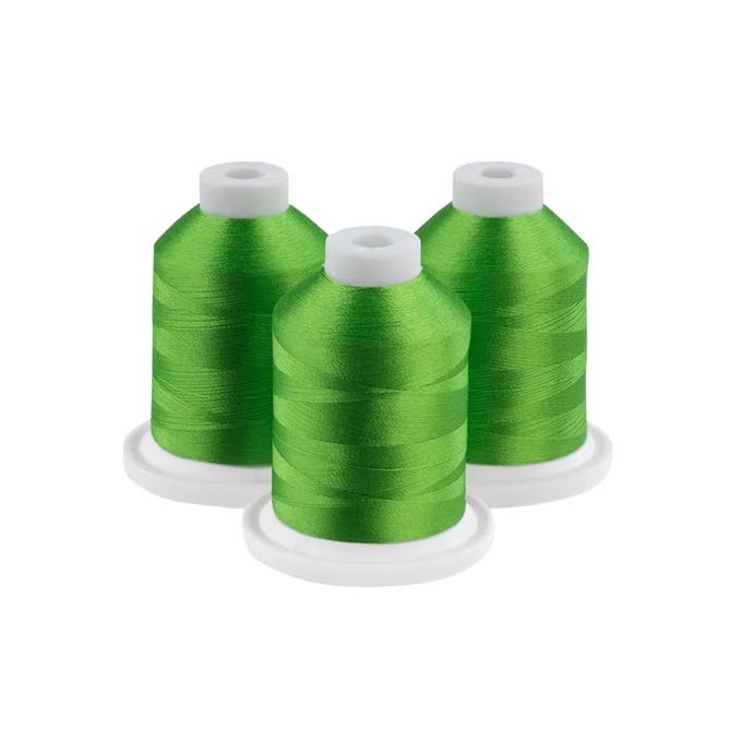Three green embroidery thread spools on white bases