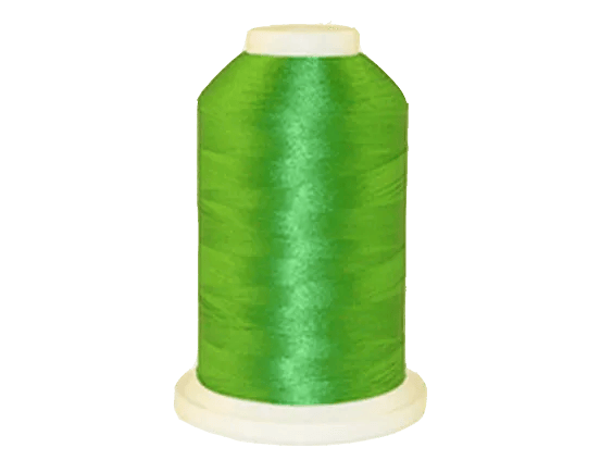 Brother bright green embroidery thread spool on white background