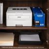 Brother HL-L2865DW wireless monochrome laser printer on shelf with toner cartridge