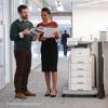 Brother MFC-L6915DW monochrome laser all-in-one printer with optional paper trays in office