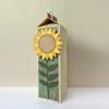Decorative wooden block with paper sunflower craft and house-shaped top