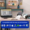 Brother QL-1110NWB wireless label printer printing shipping labels on desk with laptop
