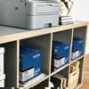 Brother laser printer on shelf with TN660 toner cartridges in home office