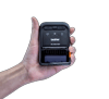 Hand holding Brother RJ-2035 portable mobile printer with thermal printing