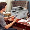 Brother wireless all-in-one laser printer on home office desk with mobile printing