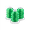 Three neon green embroidery thread spools with white caps on circular bases