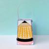 Handmade fabric pencil ornament with yellow body, pink eraser, and blue gingham border