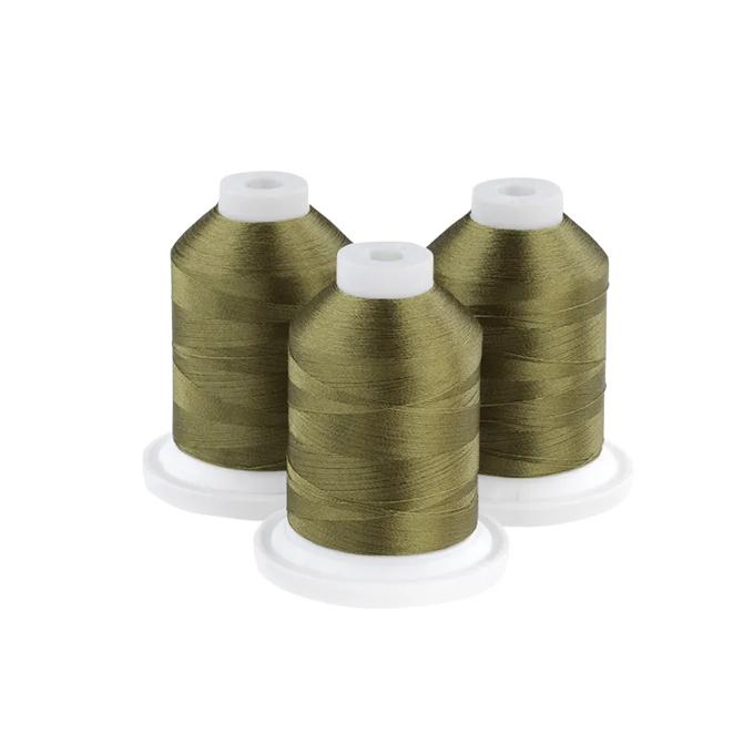 Three golden-green embroidery thread spools on white bases