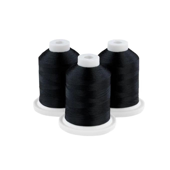Three spools of midnight teal embroidery thread on white bases