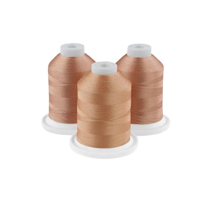 Brother embroidery thread spools in light wicker tones on white bases