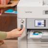 Brother all-in-one printer with USB flash drive being inserted for direct scanning
