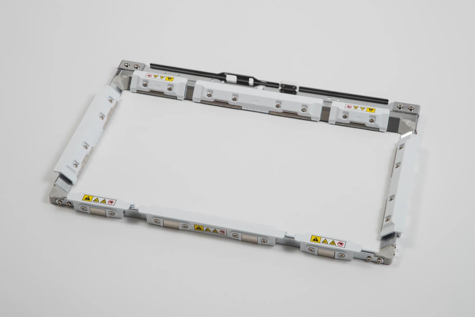 Brother printer magnetic frame component with white border and warning labels