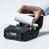 Hand loading paper roll into Brother portable thermal printer with display