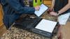 Field service worker using Brother PocketJet portable printer with fan-fold paper and wireless tablet
