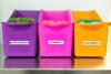 Three colorful storage bins with Brother P-touch labels for organizing snacks at home