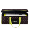 Brother ScanNCut DX cutting machine in patterned carrying tote with lime green handles