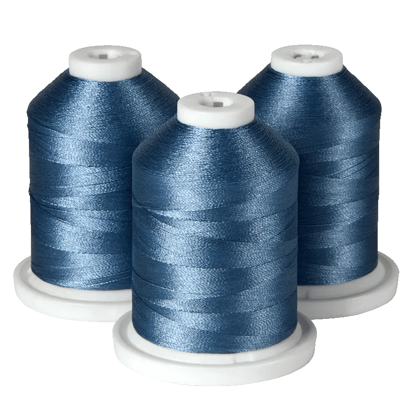 Three spools of blue embroidery thread on white bases for Brother sewing machines