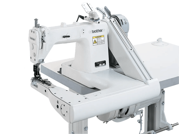 Brother industrial sewing machine with automatic thread trimmer on white frame