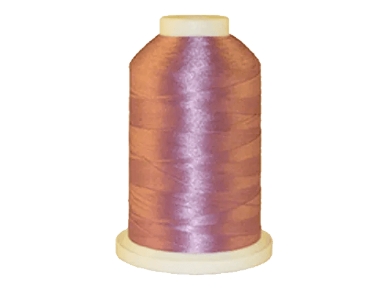 Brother embroidery thread spool in mauve purple on white background