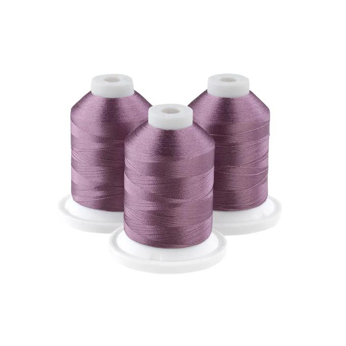 Brother embroidery thread spools in light mauve on white bases