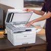 Person scanning document on Brother MFC-L2980DW monochrome laser all-in-one printer in home office
